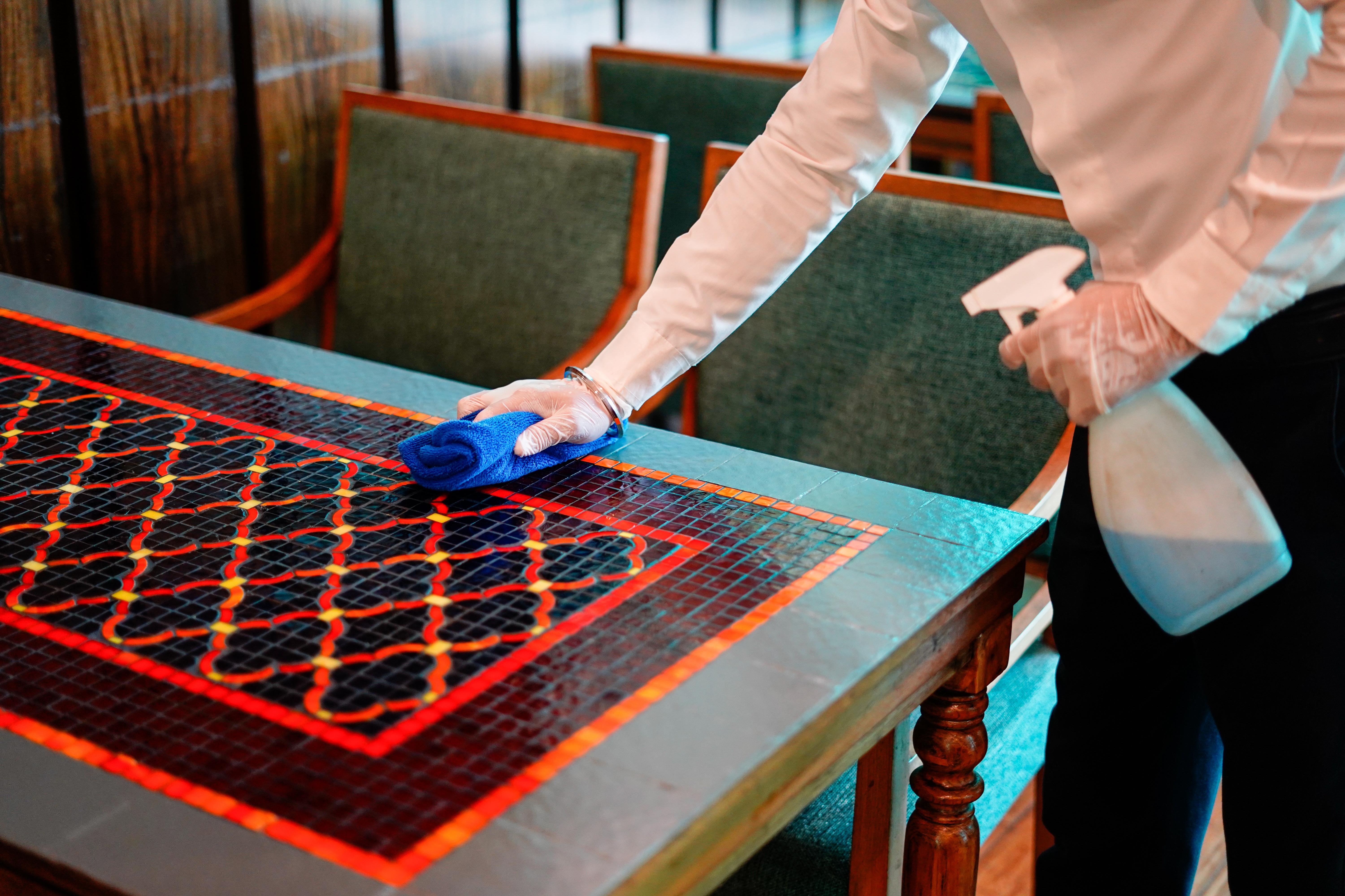 Novotel Goa Resort & Spa Candolim Extérieur photo A hotel housekeeper wiping down a table