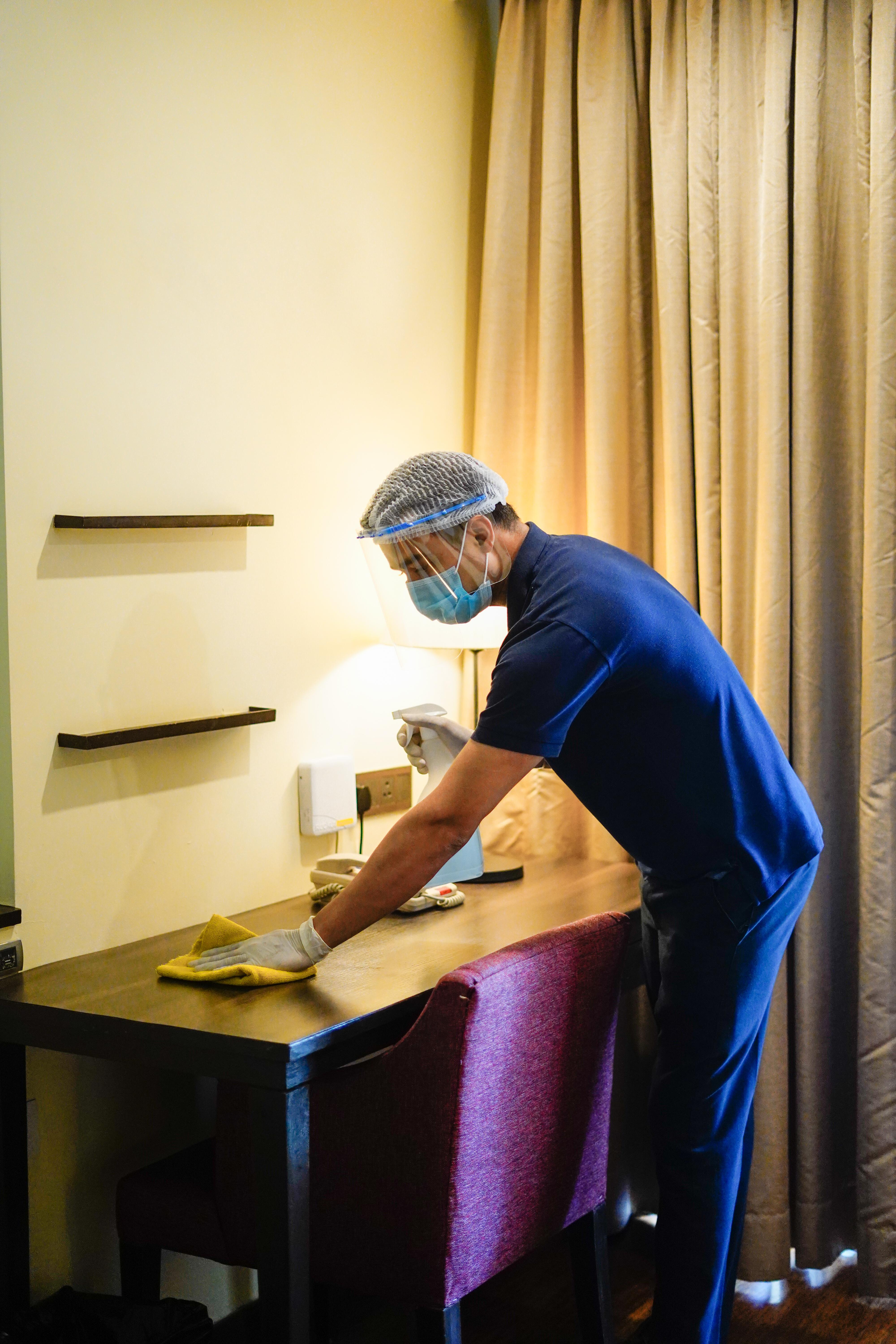 Novotel Goa Resort & Spa Candolim Extérieur photo A hotel housekeeper wearing a face shield and gloves